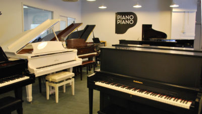 Image of a piano rental showroom