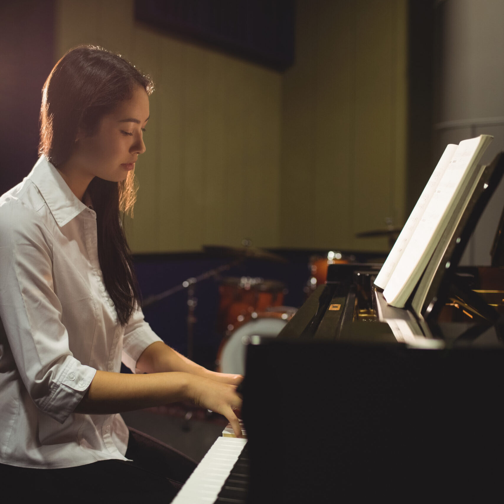 woman playing the piano